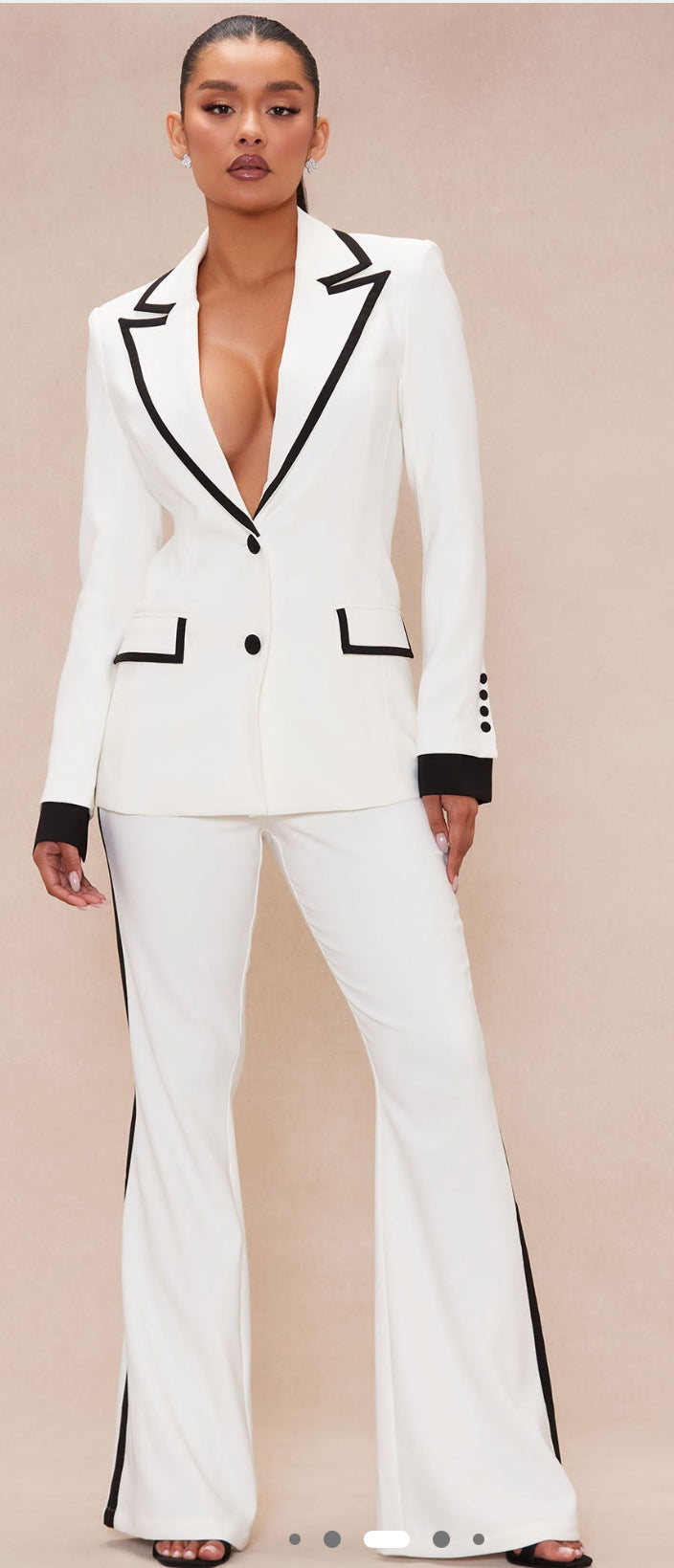 White suit. Black accent.